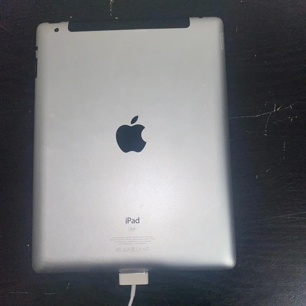 Apple Black Tablet with White Charger